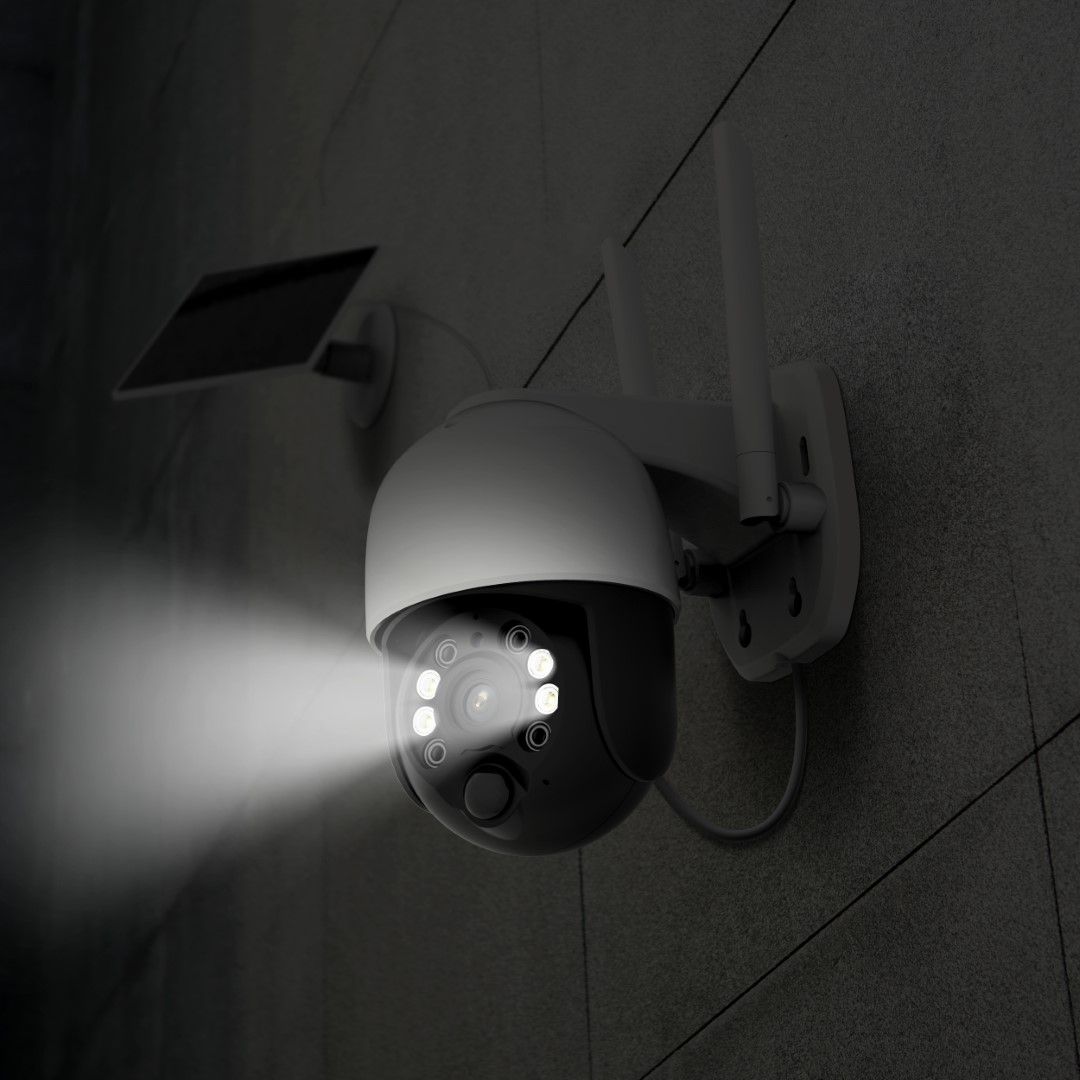 Witte Foscam B4 draadloze 4MP beveiligingscamera met spotlight en zonnepaneel gemonteerd aan een grijze buitenmuur.